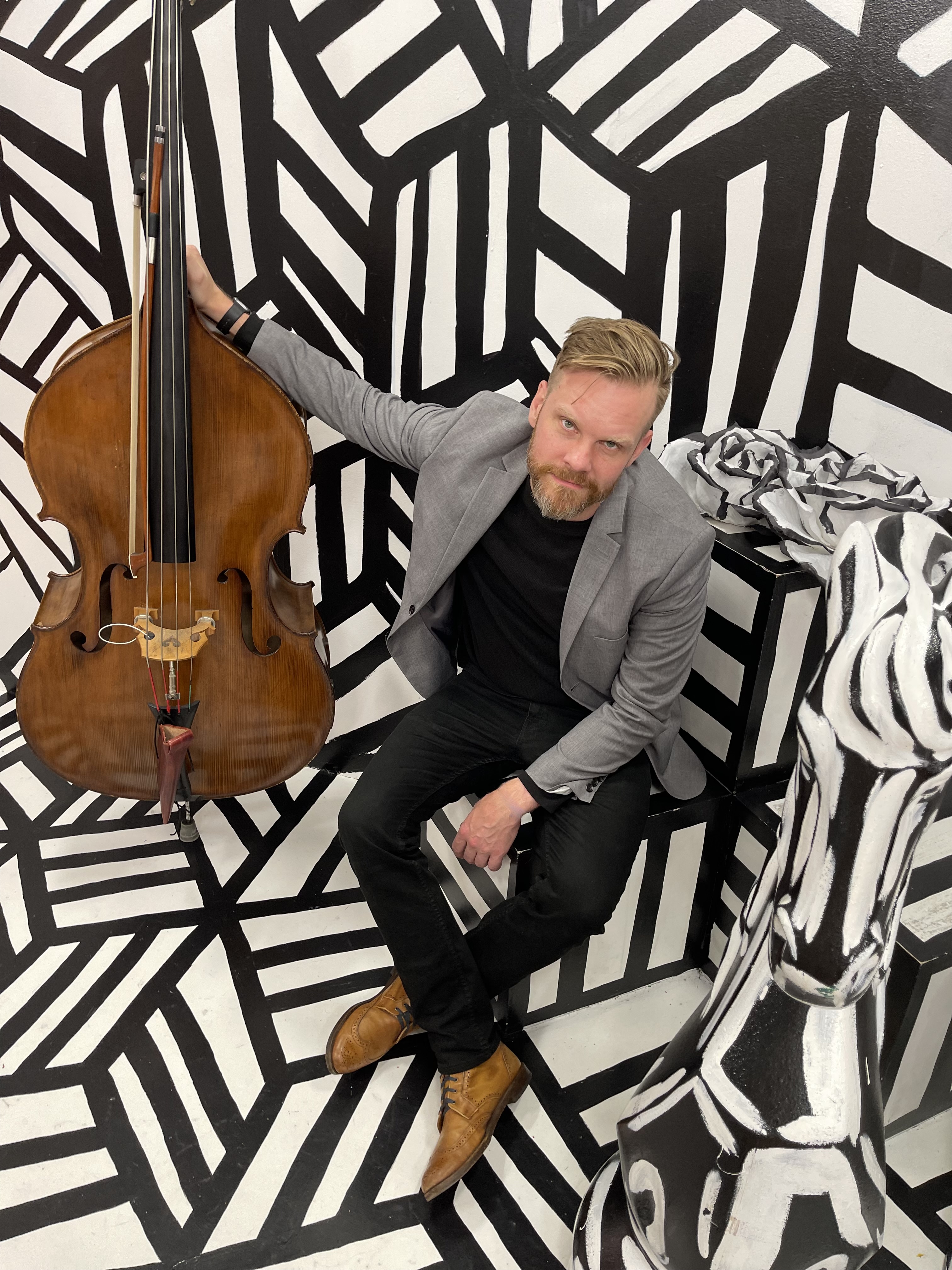 Kells performing in a black-and-white portrait.